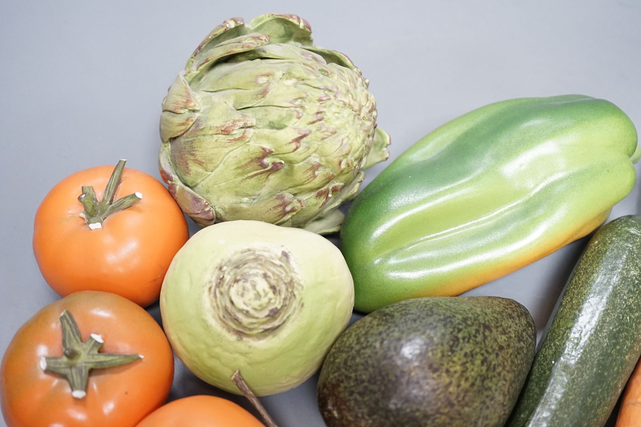 A collection of vintage Penkridge ceramic vegetables including an artichoke, avocado, peppers and asparagus (19 items)